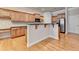 Bright kitchen featuring wooden cabinets, a black countertop, and stainless steel appliances at 1102 Lexington Dr, Roswell, GA 30075
