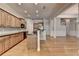 Open kitchen with stainless steel appliances, center island, breakfast bar and easy access to the living area at 1102 Lexington Dr, Roswell, GA 30075