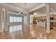 Open-concept living room and kitchen area with beautiful hardwood flooring and natural light at 1102 Lexington Dr, Roswell, GA 30075