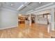 Bright and airy living area with hardwood floors, a view of the kitchen, and coffered ceilings at 1102 Lexington Dr, Roswell, GA 30075