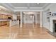 Spacious living room showcasing an open-concept layout with the kitchen, stairs and hardwood floors at 1102 Lexington Dr, Roswell, GA 30075