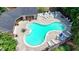 Aerial view of a community pool and lounge area with several chairs, tables and umbrellas at 1102 Lexington Dr, Roswell, GA 30075