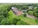 Scenic aerial view of two condo buildings nestled among lush greenery on a hillside at 3330 Overland Dr, Roswell, GA 30075