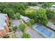 Overhead shot of complex showing condo buildings, pool, parking, and tennis court at 3330 Overland Dr, Roswell, GA 30075