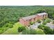 Aerial view of two condo buildings with lush green trees and landscape at 3330 Overland Dr, Roswell, GA 30075