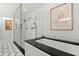 Bathroom featuring marble finishes, a modern shower, and elegant accents at 3330 Overland Dr, Roswell, GA 30075