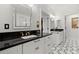 Elegant bathroom featuring stylish sinks, black countertops, and modern fixtures at 3330 Overland Dr, Roswell, GA 30075
