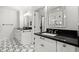 Elegant bathroom with dual vanities, sleek countertops, and patterned tile flooring at 3330 Overland Dr, Roswell, GA 30075