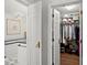 An entranceway to a stylish bathroom and walk in closet at 3330 Overland Dr, Roswell, GA 30075