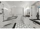 Elegant bathroom featuring marble finishes, a modern shower, and black countertops at 3330 Overland Dr, Roswell, GA 30075