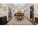 Traditional dining room featuring a wooden table, chandelier, and elegant decor at 3330 Overland Dr, Roswell, GA 30075