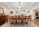 Elegant dining room features a chandelier and ample seating for formal occasions at 3330 Overland Dr, Roswell, GA 30075