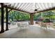 Community gazebo features a BBQ, a ceiling fan, and seating near the pool area, perfect for social gatherings at 3330 Overland Dr, Roswell, GA 30075