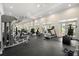 Modern fitness center equipped with various machines and weights for residents' health and wellness at 3330 Overland Dr, Roswell, GA 30075