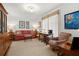 Bright living room with traditional furniture, a patterned chair, and desk at 3330 Overland Dr, Roswell, GA 30075