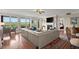 Open concept living room with hardwood floors, fireplace and access to balcony at 3330 Overland Dr, Roswell, GA 30075