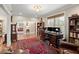 Bright office space with classic furniture and a view into living room at 3330 Overland Dr, Roswell, GA 30075