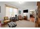 Cozy office with natural light, a decorative chair, and a view to living room at 3330 Overland Dr, Roswell, GA 30075