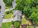 Aerial view of a single-Gathering home featuring a landscaped yard, mature trees, and a driveway with parking at 530 Camber Woods Dr, Roswell, GA 30076