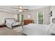 Spacious bedroom with natural light, two beds, and a serene atmosphere for restful nights and peaceful mornings at 530 Camber Woods Dr, Roswell, GA 30076