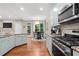 Open concept kitchen and breakfast nook offers modern appliances and view to outdoor space at 530 Camber Woods Dr, Roswell, GA 30076