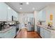 Well-equipped kitchen featuring stainless steel appliances, granite countertops, and ample cabinet space, ready for culinary adventures at 530 Camber Woods Dr, Roswell, GA 30076