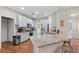 Updated kitchen with granite countertops, stainless steel appliances, and ample storage, perfect for cooking and entertaining at 530 Camber Woods Dr, Roswell, GA 30076