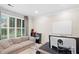 Bright office space featuring a comfortable sofa, a large window, and a whiteboard at 530 Camber Woods Dr, Roswell, GA 30076