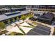 Aerial view showcasing community's layout, commercial spaces, landscaping, and pedestrian-friendly areas at 6895 Whitman Walk, Alpharetta, GA 30005