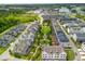 Scenic aerial view of a new residential neighborhood with a central green space and manicured lawns at 6895 Whitman Walk, Alpharetta, GA 30005