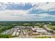 High angle view showing residential neighborhood next to office park, and distant green forests at 6895 Whitman Walk, Alpharetta, GA 30005