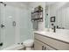 Updated bathroom with glass-enclosed shower, tile, and modern vanity at 6895 Whitman Walk, Alpharetta, GA 30005