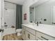 Well-lit bathroom with white vanity, subway tile shower, and modern fixtures offering a clean and stylish aesthetic at 6895 Whitman Walk, Alpharetta, GA 30005