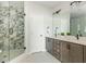 Modern bathroom featuring dual sinks, a glass-enclosed shower, and contemporary finishes for a sleek and stylish design at 6895 Whitman Walk, Alpharetta, GA 30005