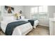 Bright bedroom showcasing two twin beds, neutral decor, and natural light creating a cozy and inviting atmosphere at 6895 Whitman Walk, Alpharetta, GA 30005