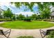 Lush green common area with manicured landscaping, benches, and a central focal point, offering a serene community space at 6895 Whitman Walk, Alpharetta, GA 30005