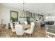 Open concept dining room with chandelier at 6895 Whitman Walk, Alpharetta, GA 30005