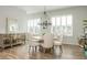 Dining room with windows, neutral walls, and chandelier at 6895 Whitman Walk, Alpharetta, GA 30005