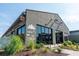 The Thousand Hills Coffee building exterior with large windows, modern design, and inviting signage at 6895 Whitman Walk, Alpharetta, GA 30005