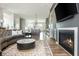 Open living area with fireplace, television, and views of the kitchen at 6895 Whitman Walk, Alpharetta, GA 30005