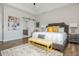 Bright main bedroom features neutral walls, a large window, stylish rug and a comfy bed with elegant accents at 6895 Whitman Walk, Alpharetta, GA 30005
