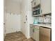 Mudroom features built-in storage, microwave, beverage fridge, and coffee bar at 6895 Whitman Walk, Alpharetta, GA 30005