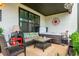 Relaxing covered patio with comfortable seating, a hot tub, and decorative elements, perfect for outdoor enjoyment at 6895 Whitman Walk, Alpharetta, GA 30005