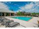 Community pool area features a pool, lounge chairs, an open air clubhouse, and lovely blue skies at 6895 Whitman Walk, Alpharetta, GA 30005