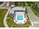 An aerial shot of a community pool and clubhouse, surrounded by lounge seating and walking trails at 6895 Whitman Walk, Alpharetta, GA 30005