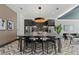 Stylish dining area showcasing a long table, modern lighting, and sleek appliances for communal gatherings at 775 Juniper St # 111, Atlanta, GA 30308