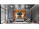 Inviting lobby area with seating and decorative wood paneled wall at 775 Juniper St # 111, Atlanta, GA 30308
