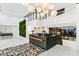 Bright lobby area with high ceilings, a reception desk, and decorative lighting at 775 Juniper St # 111, Atlanta, GA 30308