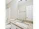 Bathroom featuring a single sink, granite counters, walk-in shower, and white cabinets at 1147 Saint Phillips Ct, Locust Grove, GA 30248