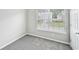 Bedroom with a window view of the neighborhood at 1147 Saint Phillips Ct, Locust Grove, GA 30248